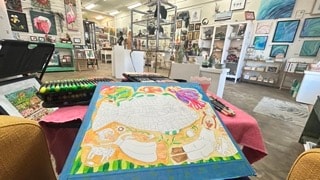 Robbin Robertson painting on display at Moon Over Water gallery