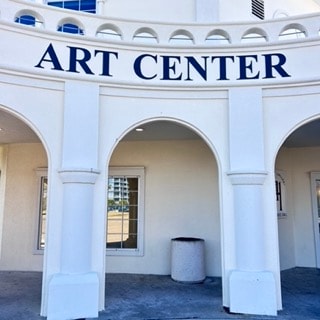 Art Center building exterior with white columns and arches