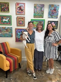 Three women at Moon Over Water gallery in Rockport, Texas