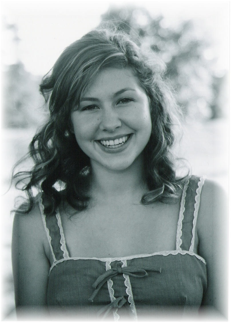 Black and white portrait of young woman smiling