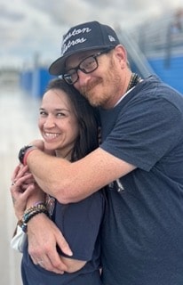 Smiling couple embracing outdoors